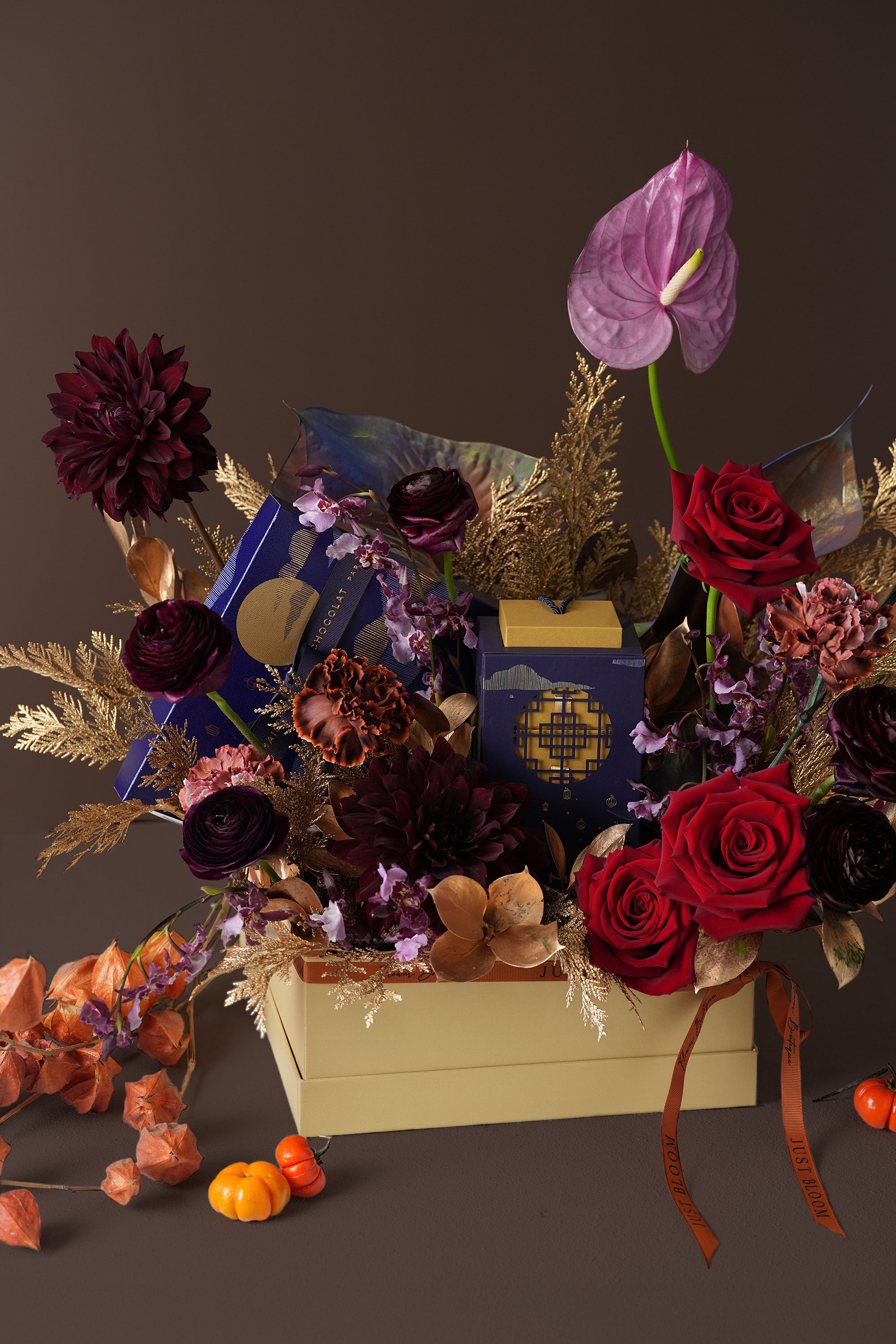 Lunar Elegance floral gift box featuring mooncakes and chocolates with deep crimson and purple flowers
Lunar Elegance