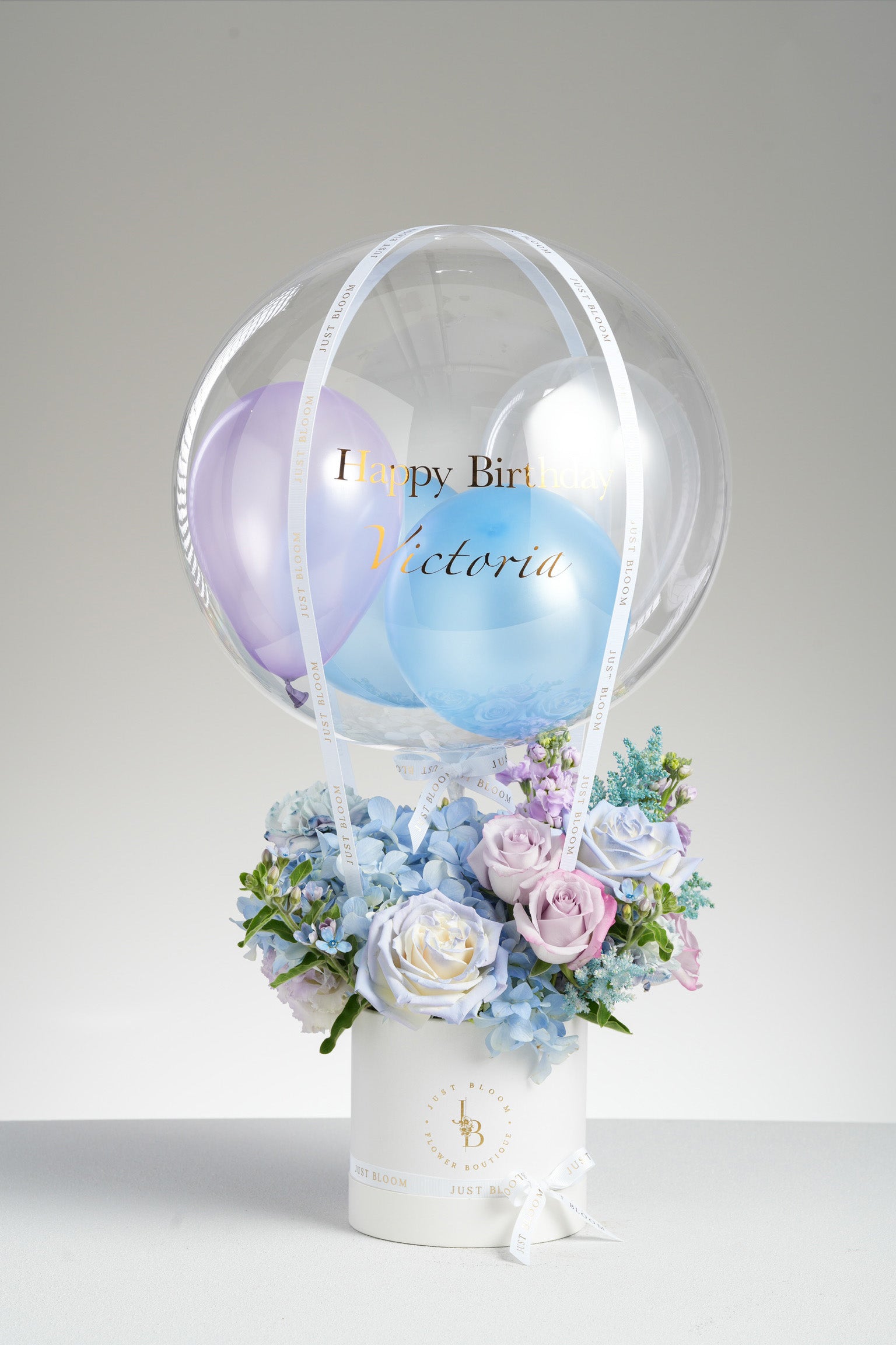 Lydia dreamy blue and purple birthday balloon flower box with pastel latex balloons in white round hatbox