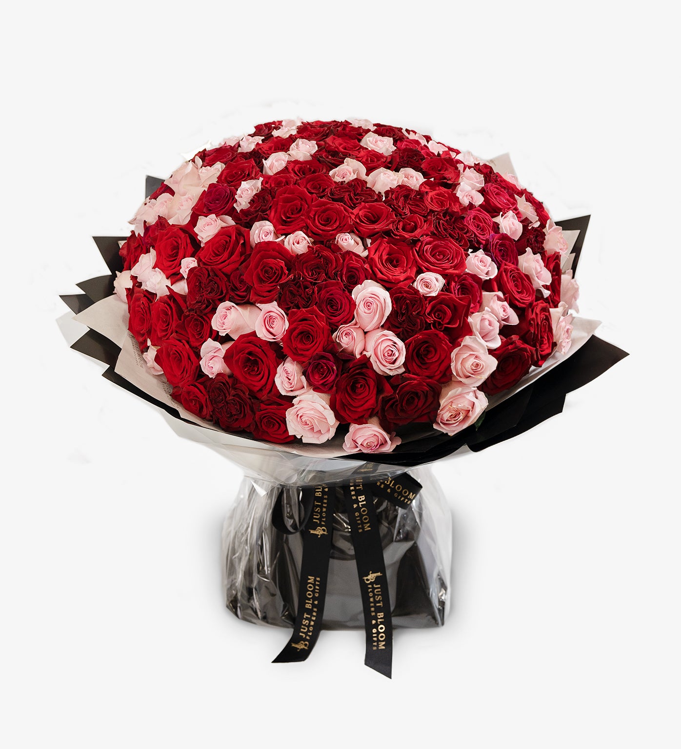 Marisol bouquet featuring premium red and pink Ecuadorian roses arranged in a round dome shape
