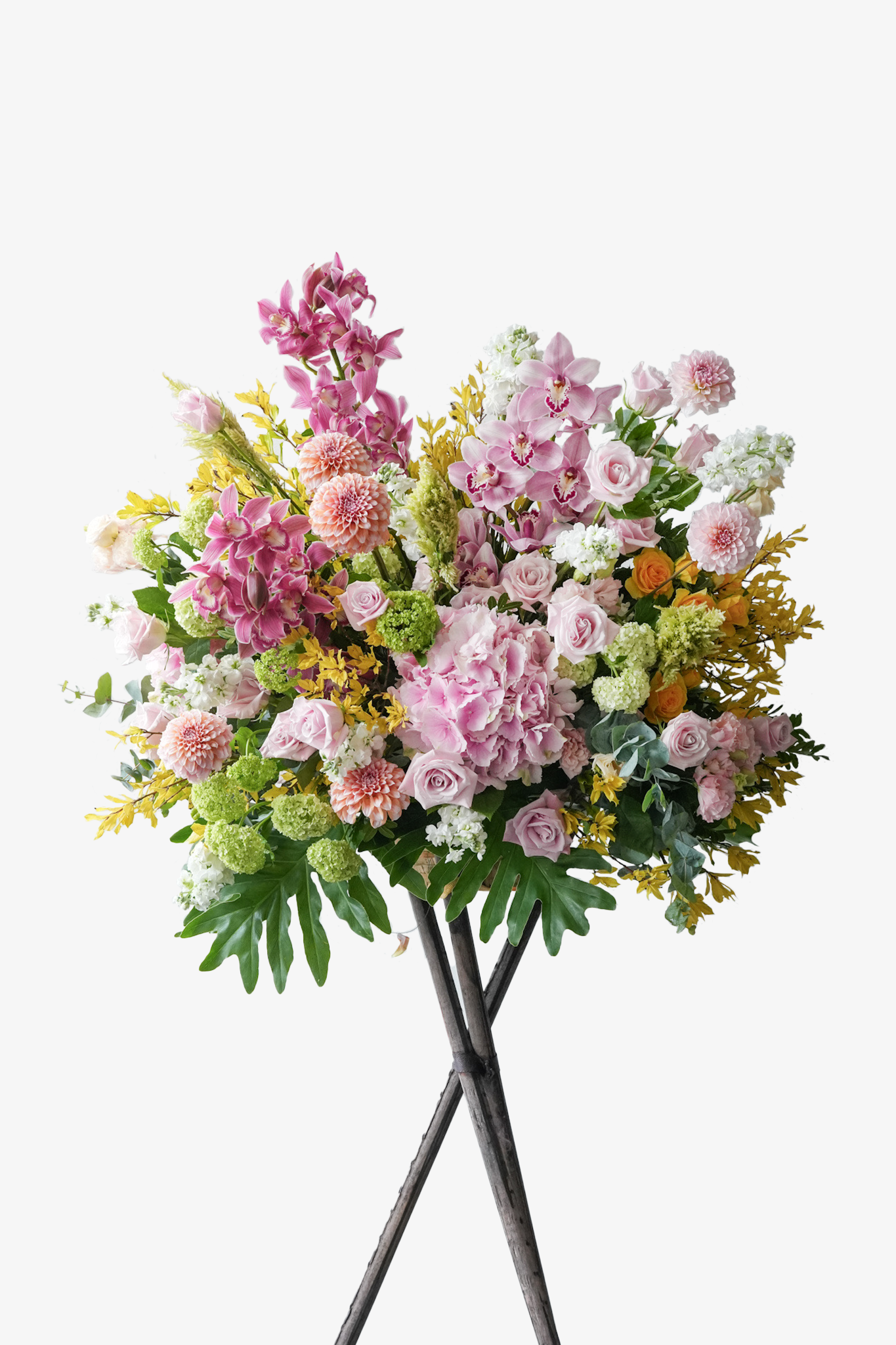 Marseille grand opening flower stand with pink cymbidium orchids, blush dahlias, lavender roses, hydrangeas, white stock, viburnum, and yellow accents 