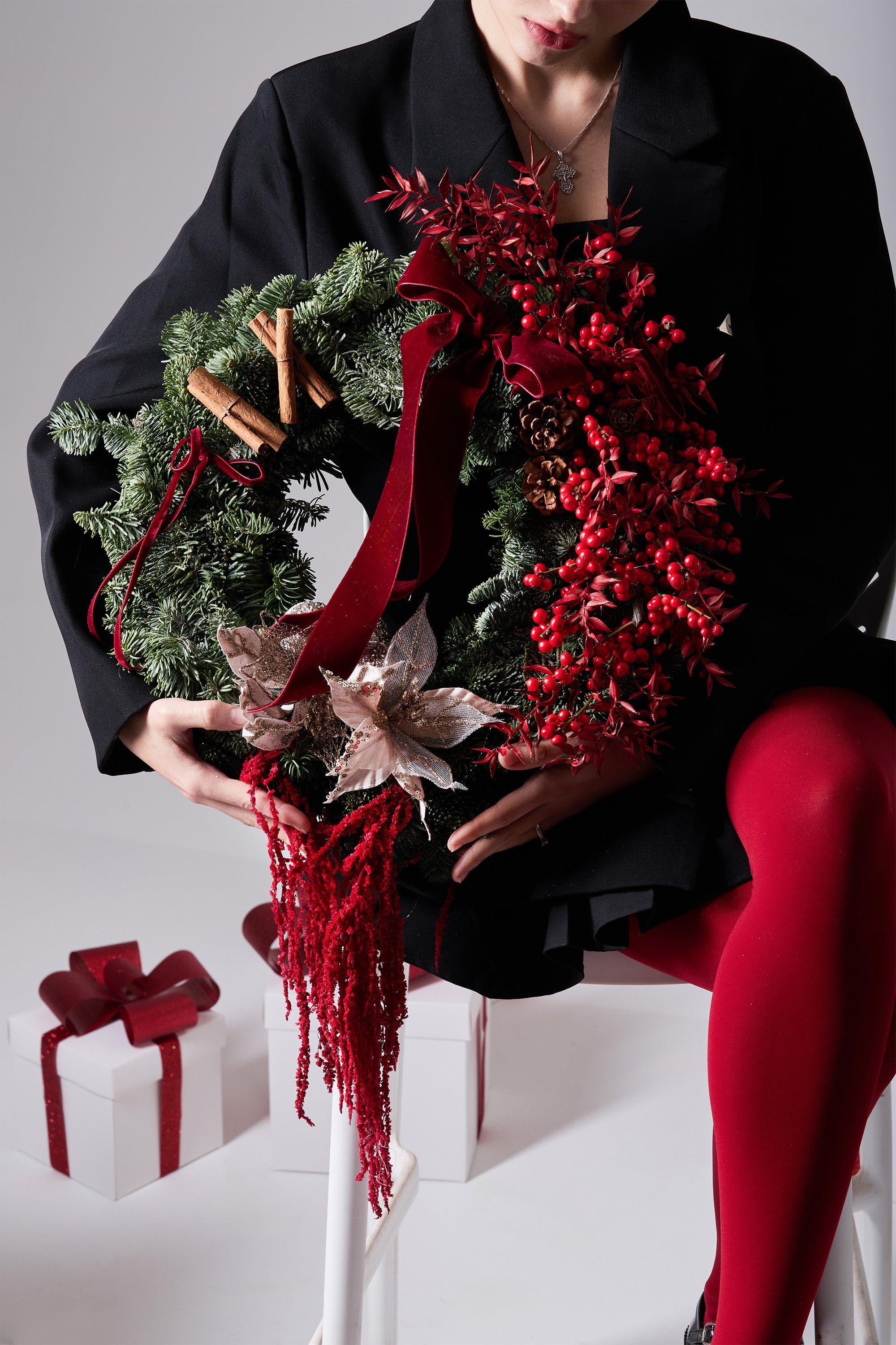 Merlot Solstice Christmas wreath featuring pine textures and berry accents
