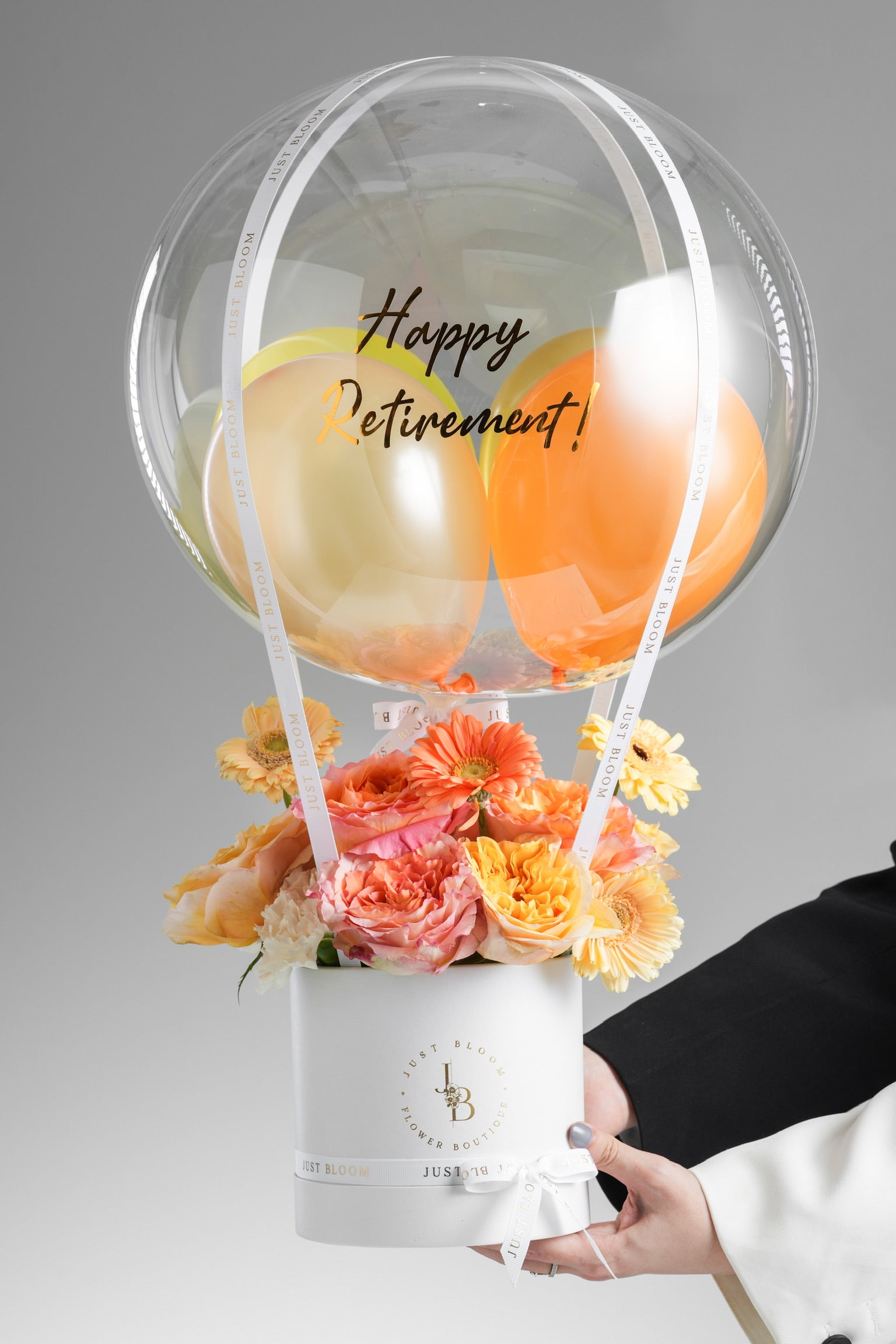 Michaela peach and yellow flower arrangement gift box with crystal balloon, roses, gerberas, and carnations