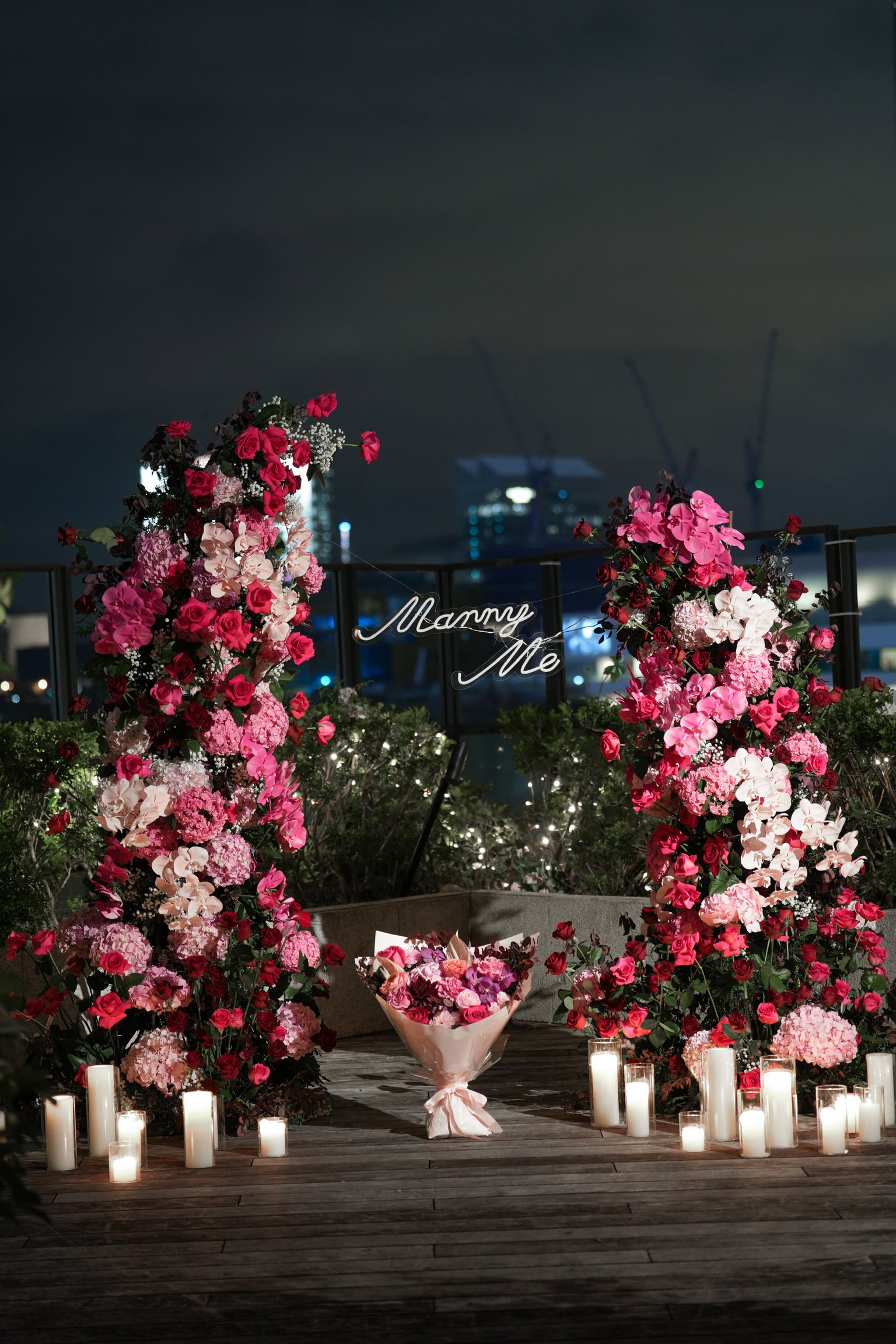Midnight Bloom rooftop proposal floral setup with red and pink roses – Just Bloom Hong Kong.