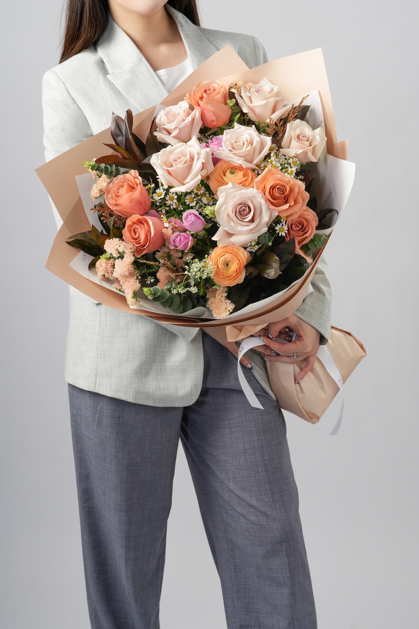 Mocha bouquet with brown roses, sand roses, ranunculus, and floral fillers