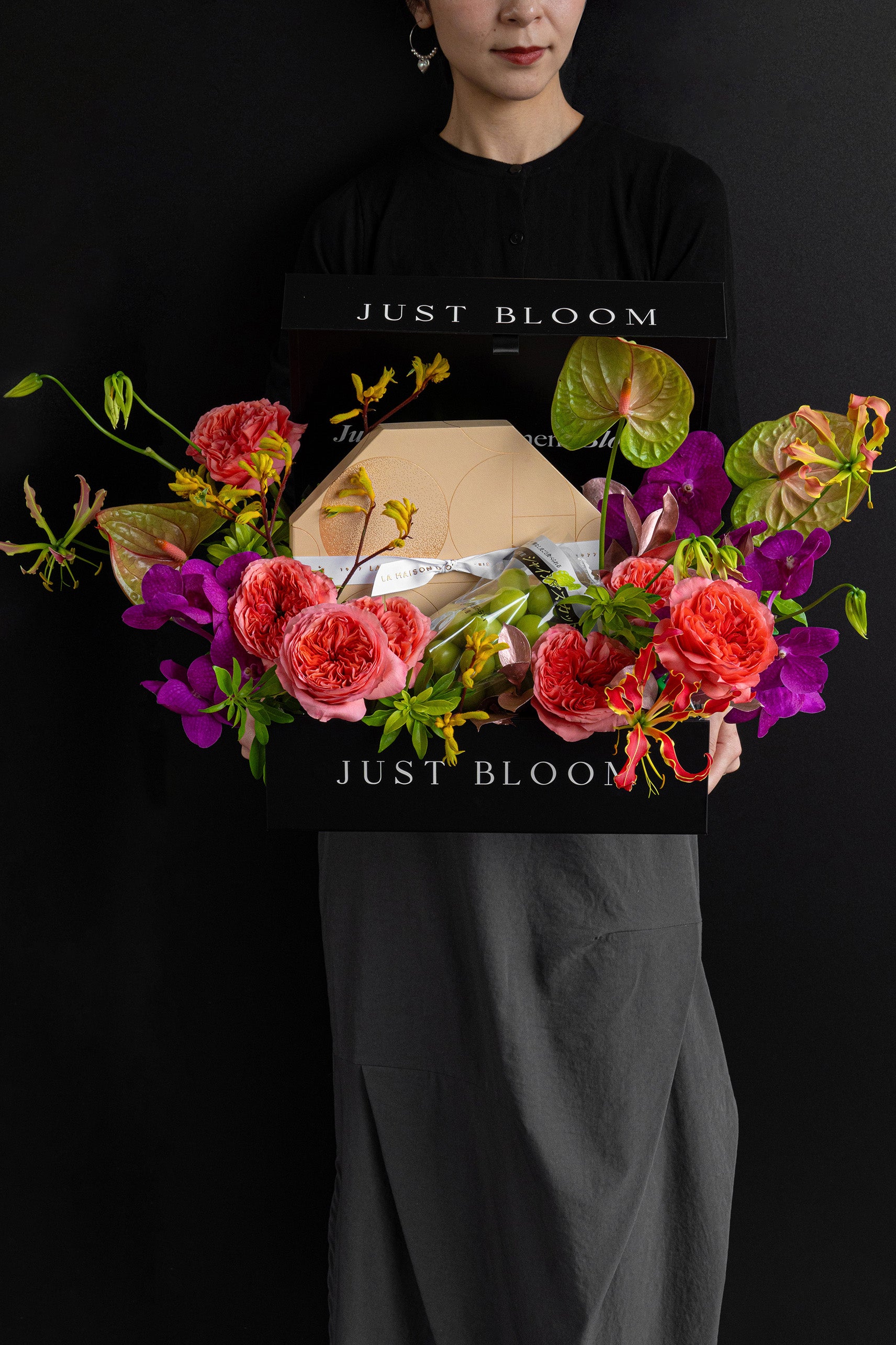 Model holding Just Bloom Moonlit Treasure flower box with coral pink and violet florals and chocolate gift box — Just Bloom Hong Kong