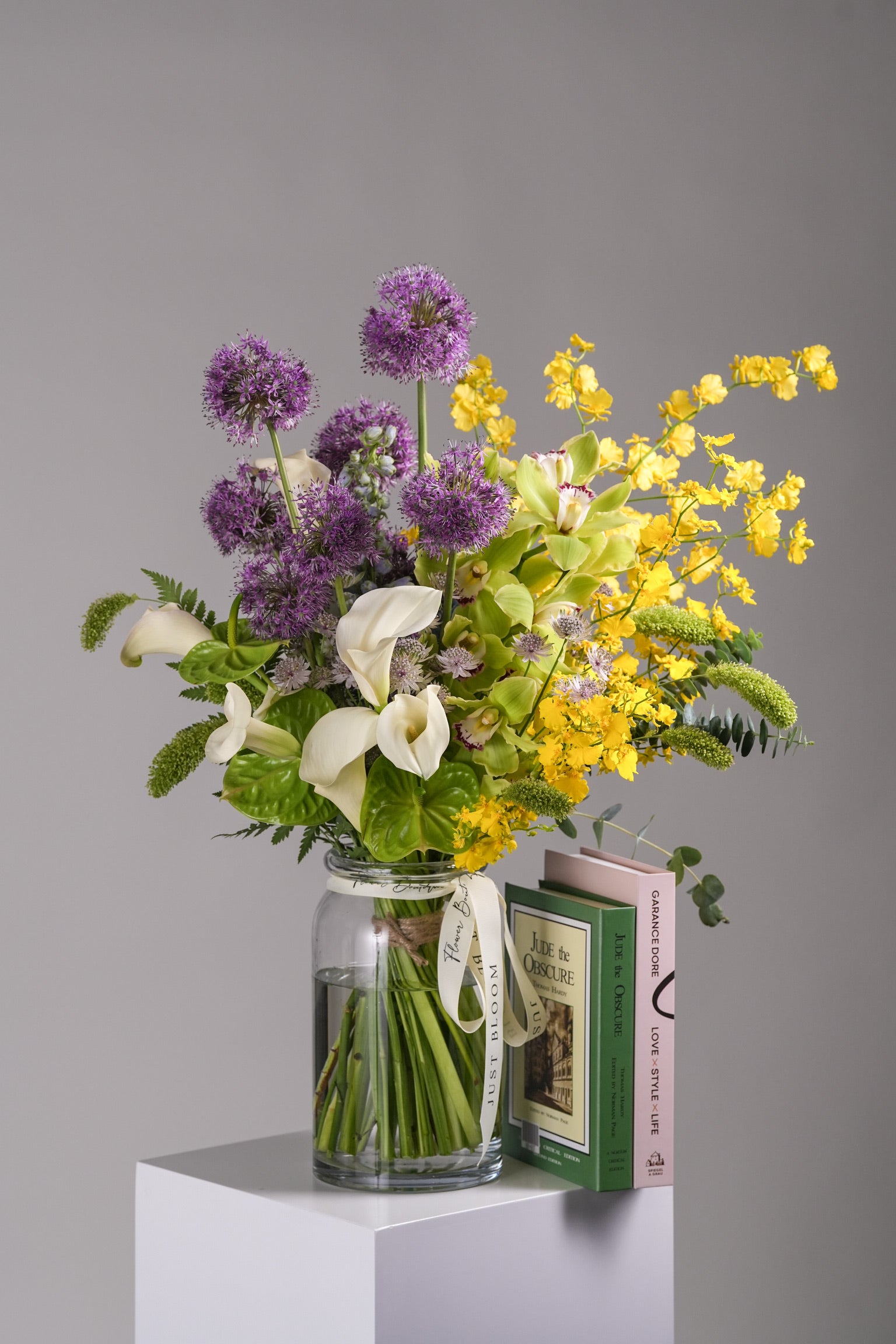Myra Vase Arrangement with Giant Alliums, Anthuriums, Dancing Lady Orchids, Cymbidium Orchids, Calla Lilies, and Astrantias by Just Bloom Hong Kong