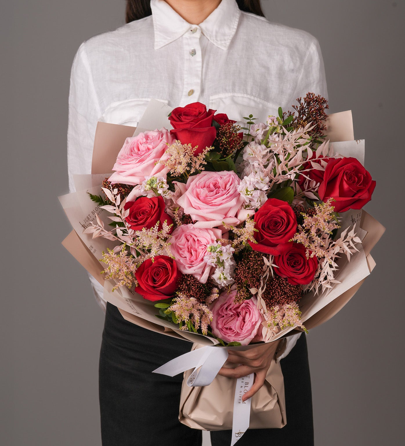 Noa bouquet with red and pink Ecuadorian roses, garden roses, Dutch stocks and astilbes