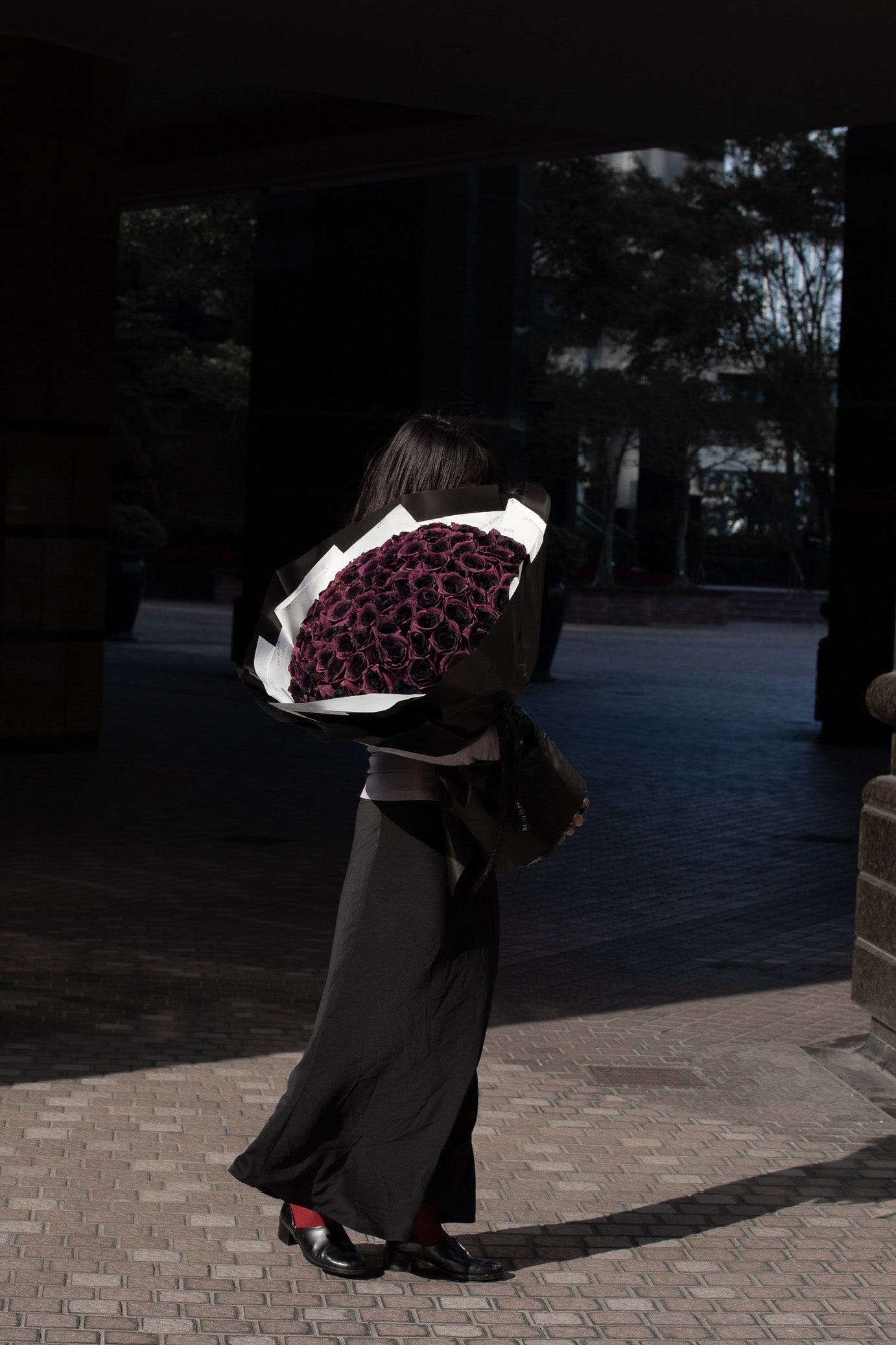 Noir Velvet modern statement bouquet featuring deep plum roses