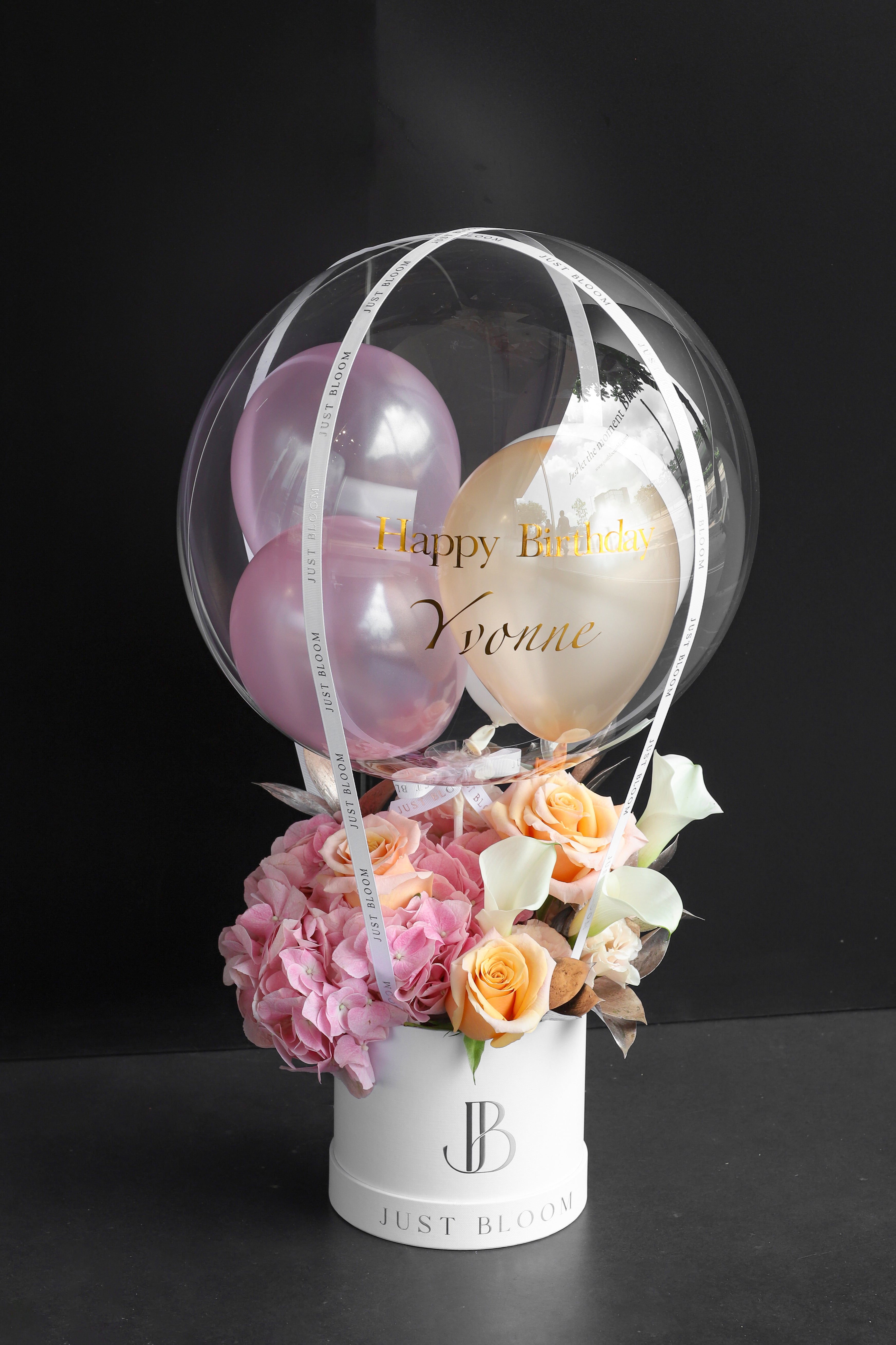 Fresh flower box with pink Hydrangeas, peach Roses, white Calla Lilies, and dried foliage in a white Just Bloom round box against a dark background — Just Bloom Hong Kong