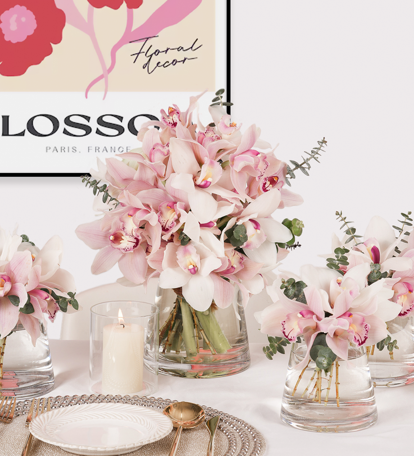 Pink Paradise centrepiece with cymbidium orchids in large and small vases