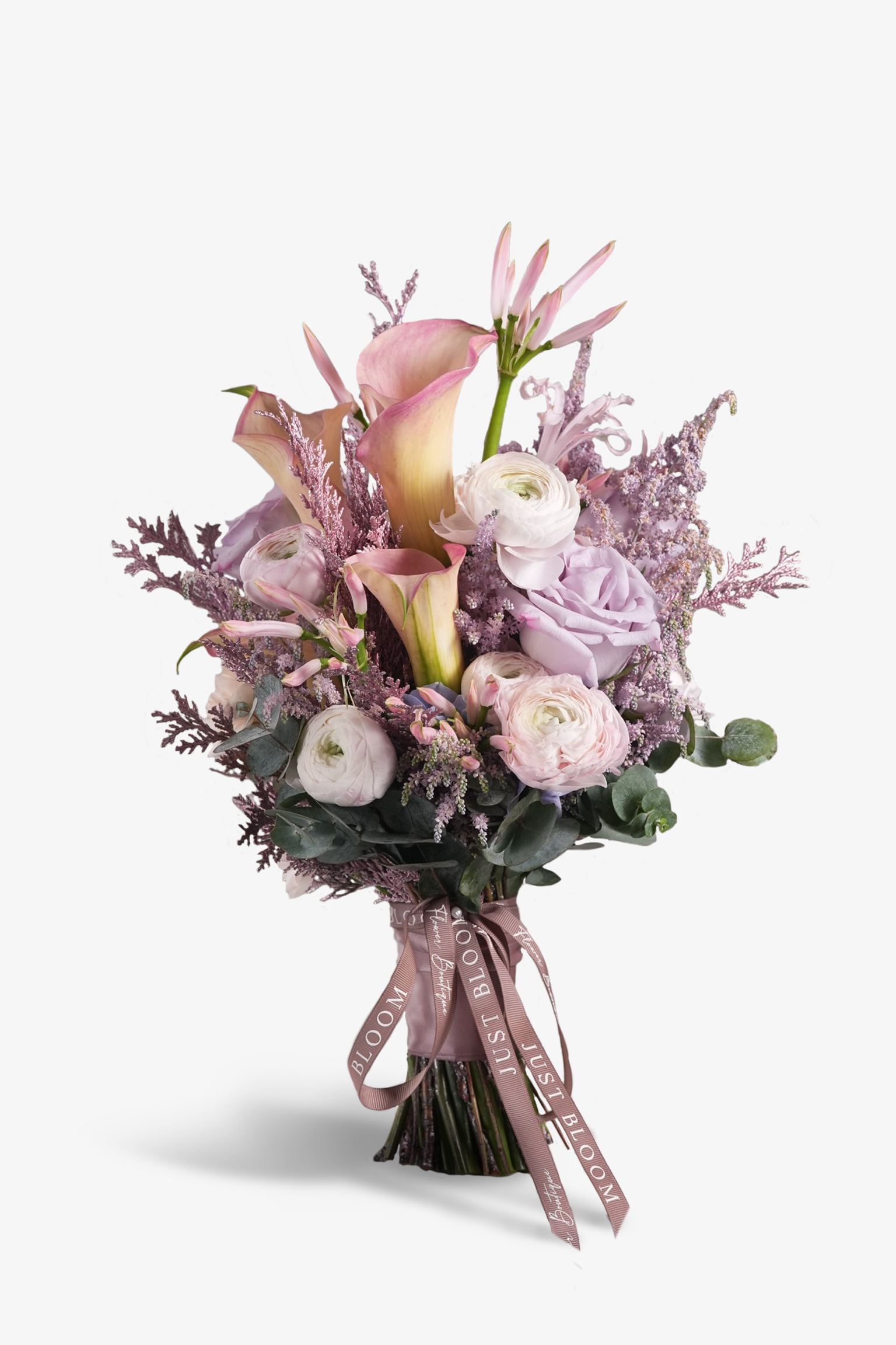 Priscilla bridal bouquet with calla lilies, pink ranunculus, roses, astilbes and eucalyptus