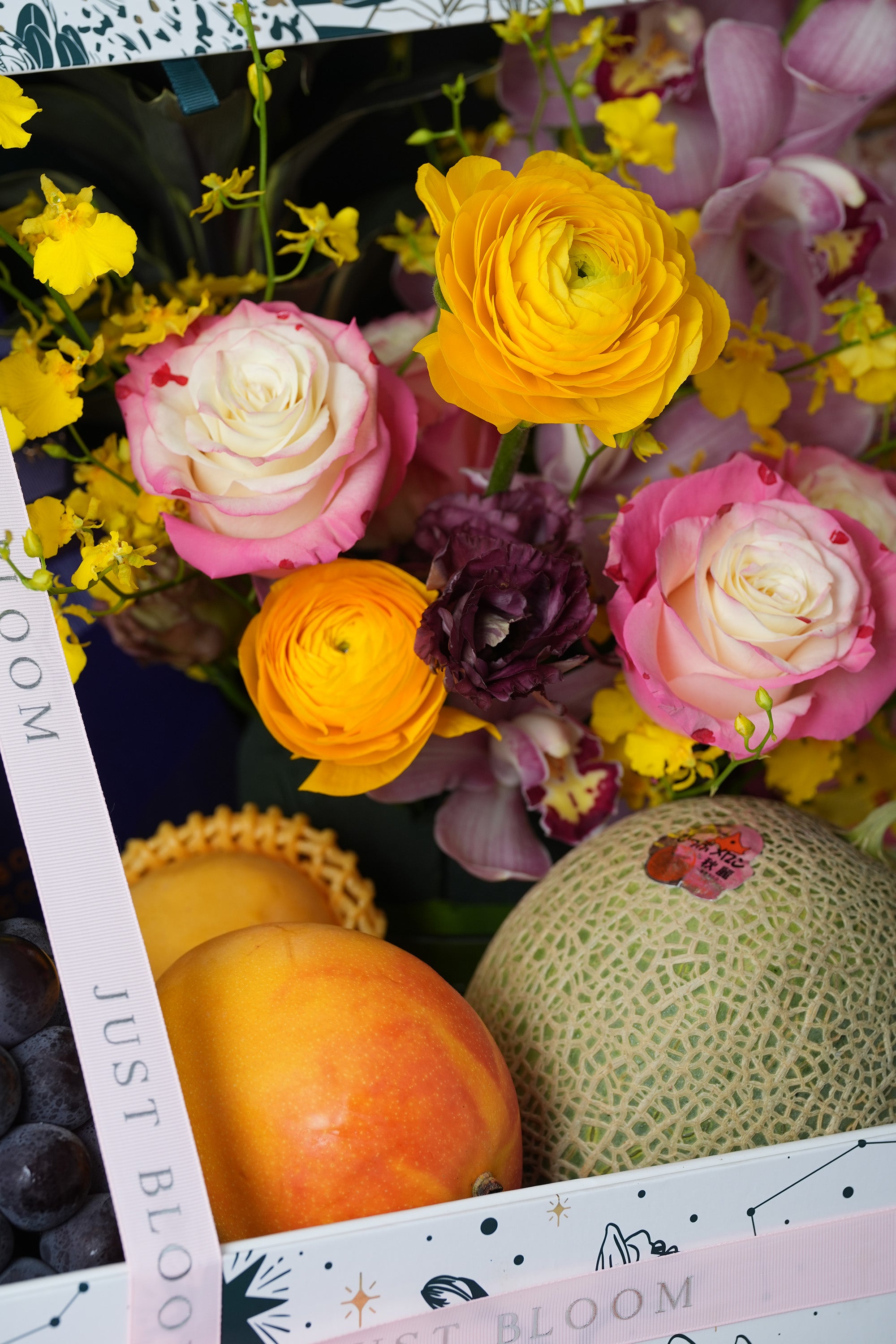 Radiant Harvest Mid-Autumn floral hamper with cymbidium orchids, grapes, and optional champagne add-on