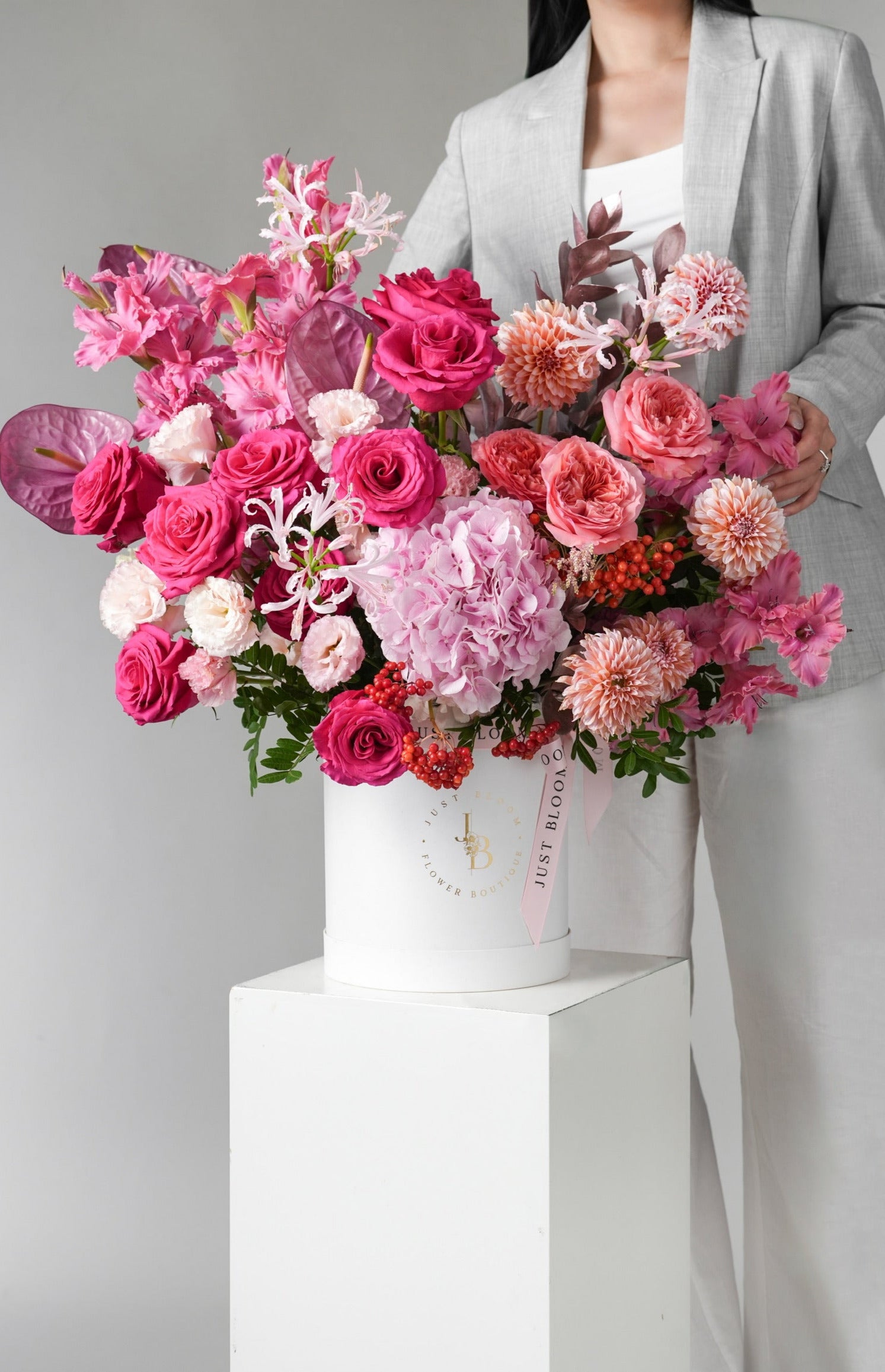 Roselle bold pink berry hatbox with dahlias, roses, hydrangeas and anthuriums