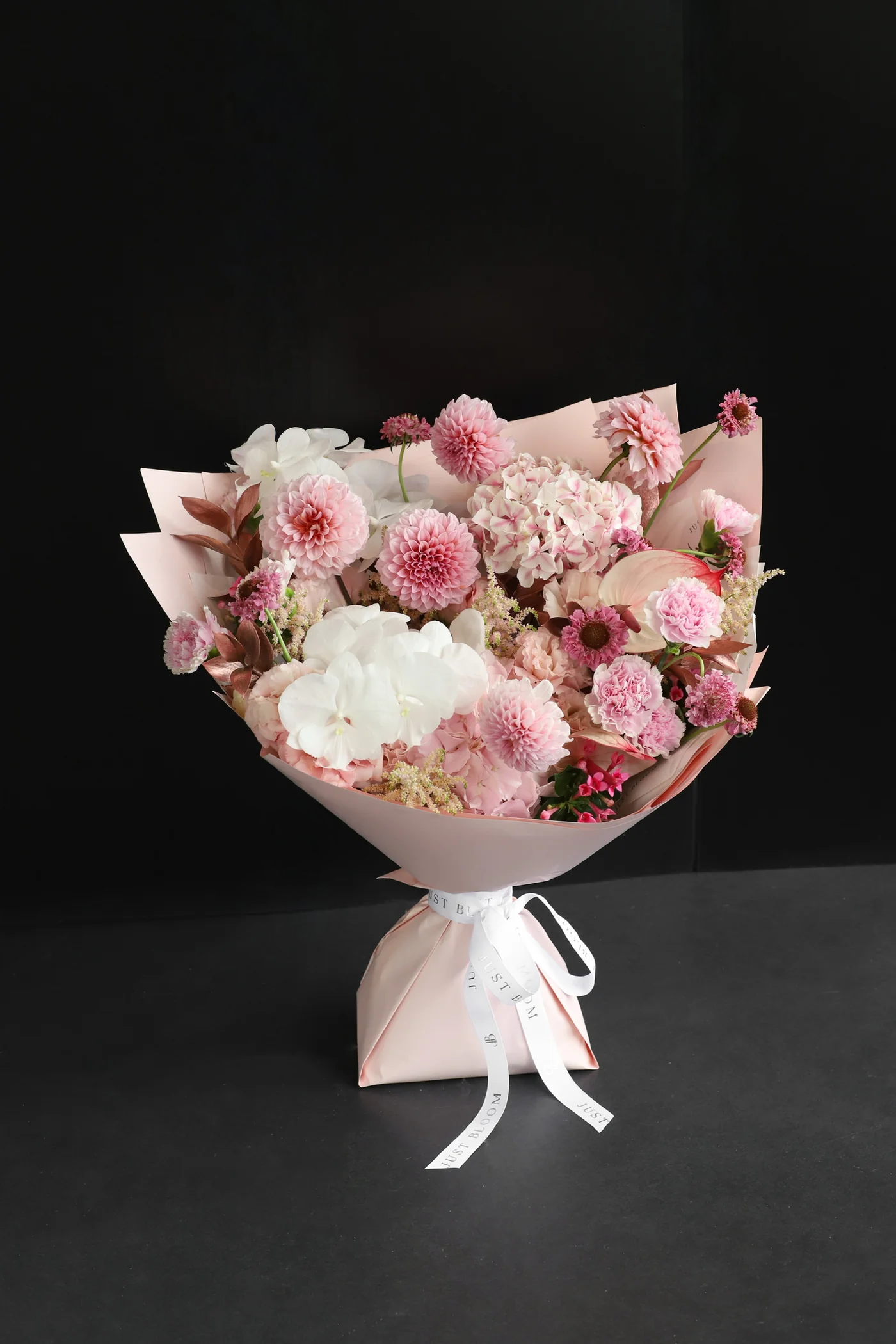 Rosette is a pink & white bouquet featuring Dahlias, Hydrangeas & Orchids. Ideal for birthdays & anniversaries. Order from Just Bloom Hong Kong.