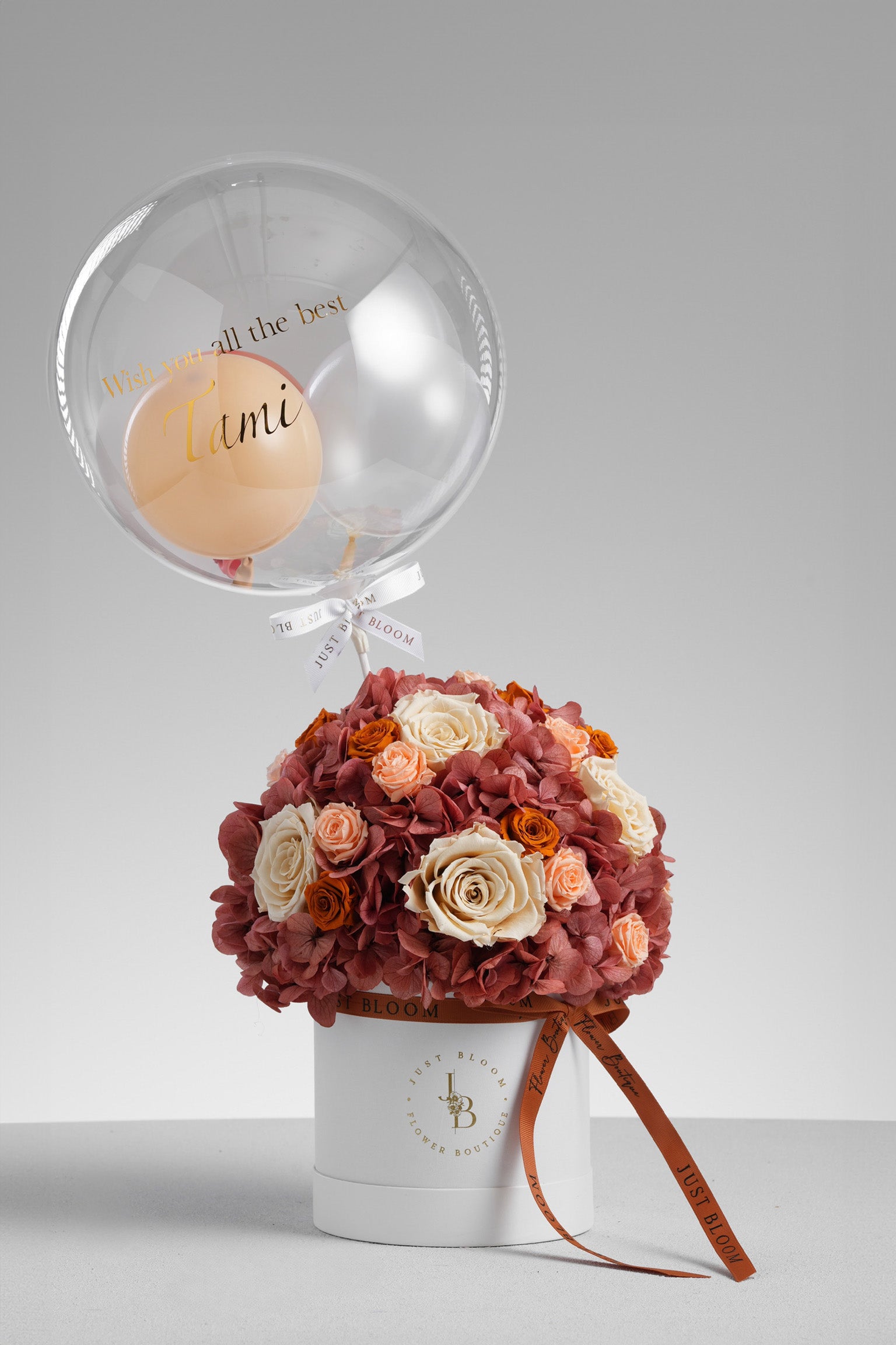 Salem - A preserved flower box in burnt orange and nude tones with preserved roses, hydrangeas, and a crystal balloon topper. Elegant gift by Just Bloom HK.