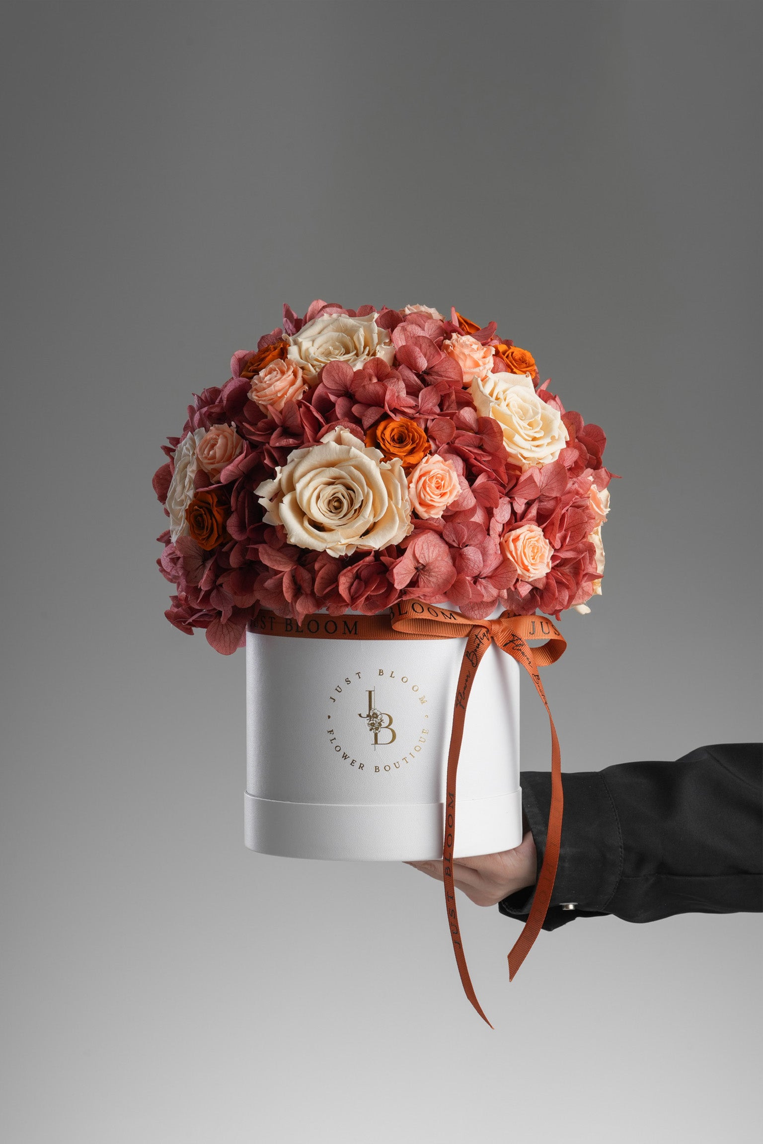 Salem - A preserved flower box in burnt orange and nude tones with preserved roses, hydrangeas, and a crystal balloon topper. Elegant gift by Just Bloom HK.