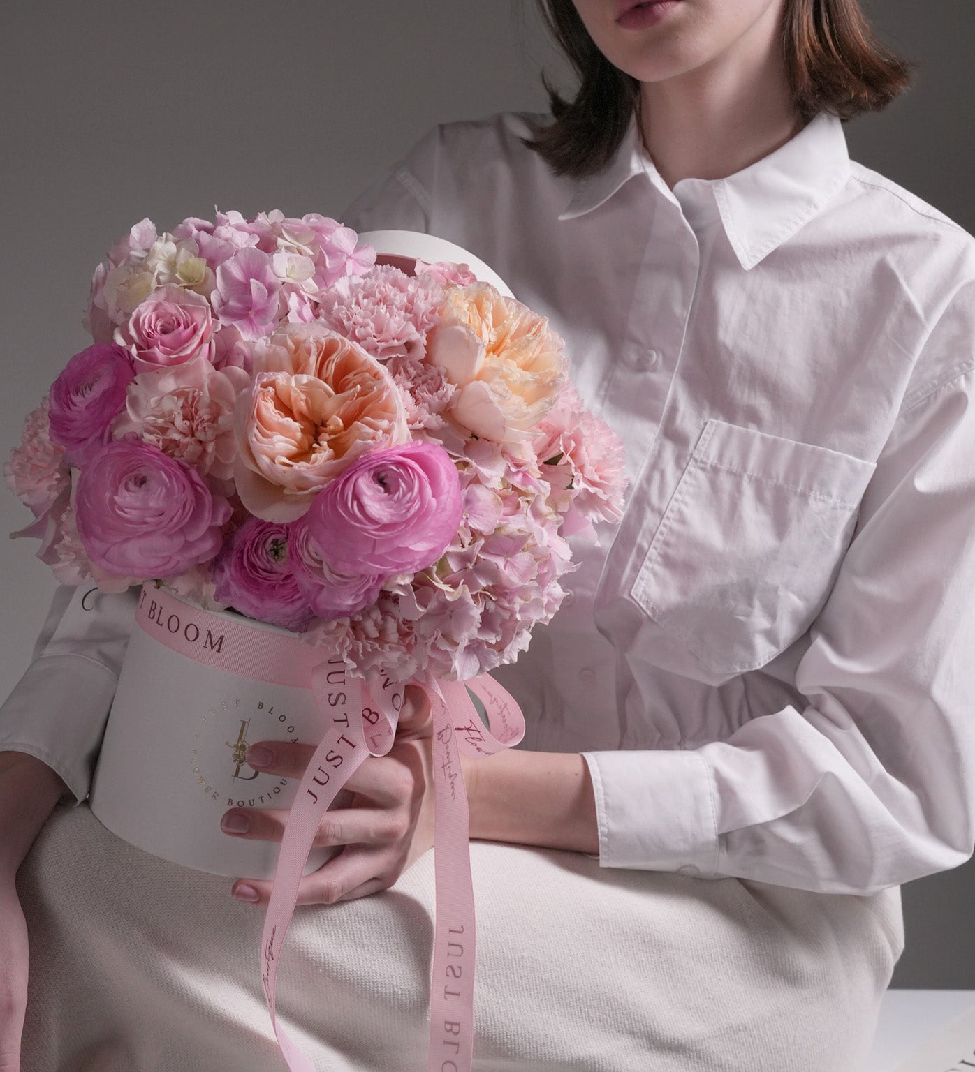 Scented Memories flower box with Juliet garden roses, pink ranunculus, hydrangeas and carnations in pastel tones
