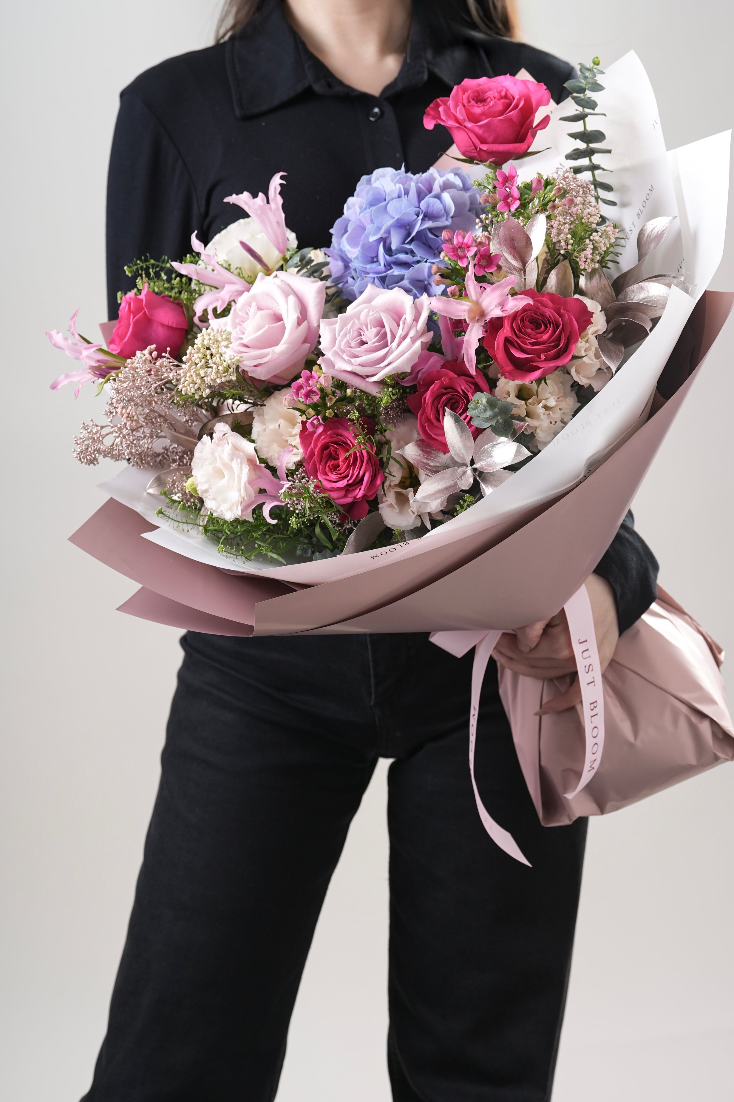 Sienna bouquet featuring hydrangeas, pink roses, and greenery