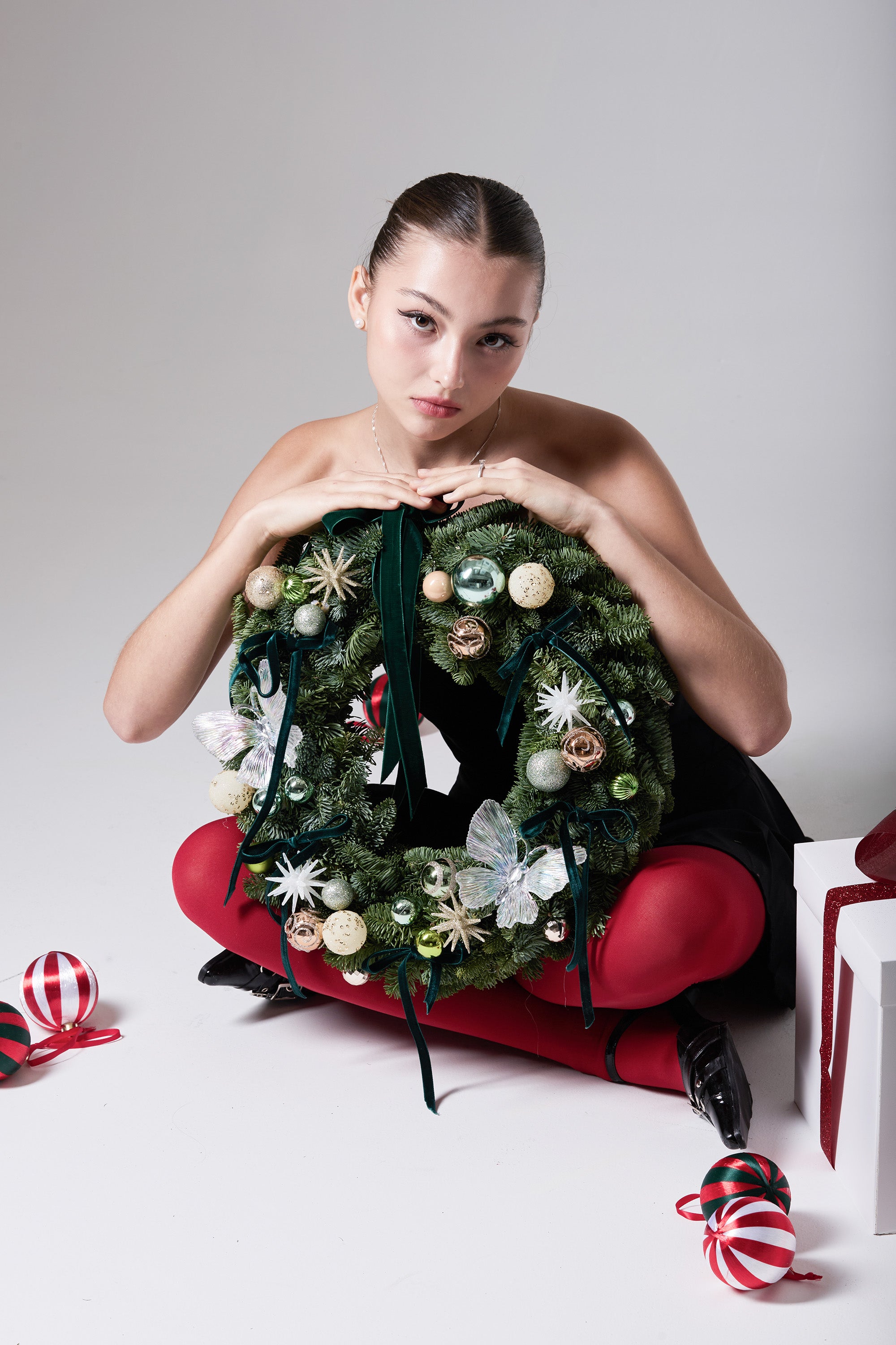 Snowlight Velvet wreath with velvet ribbon, iridescent butterfly ornaments and mixed evergreens