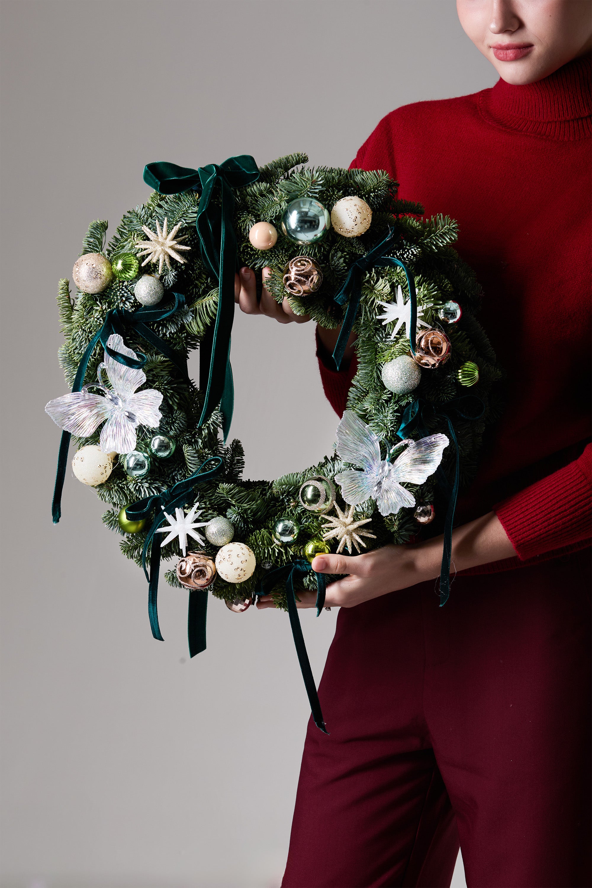 Snowlight Velvet Christmas wreath featuring green ornaments and metallic details