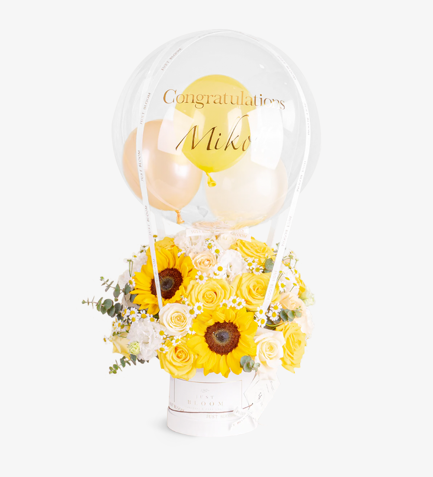 Stella bouquet with sunflowers, chamomiles, Ecuadorian roses, spray roses, and eustomas in a yellow dome flower box