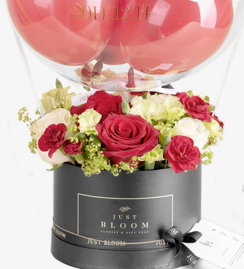 An image of a stunning Flower Box from 【Just Bloom】 featuring premium Ecuadorian roses, Dutch spray roses, eustomas, and greenery, evoking a passionate and romantic atmosphere.