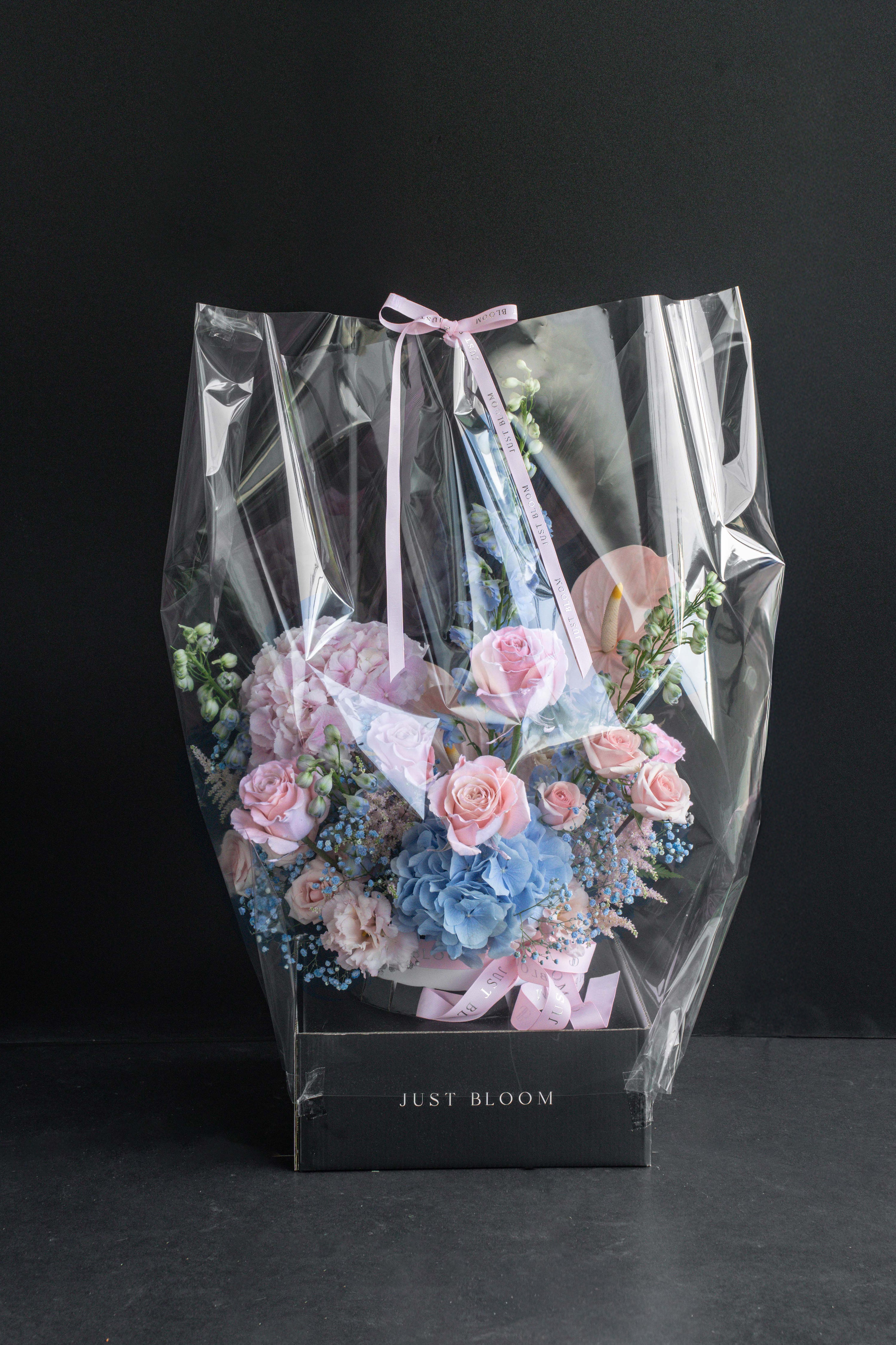 Sweet Rhapsody flower box wrapped in clear cellophane with a Just Bloom ribbon, ready for delivery — Just Bloom Hong Kong