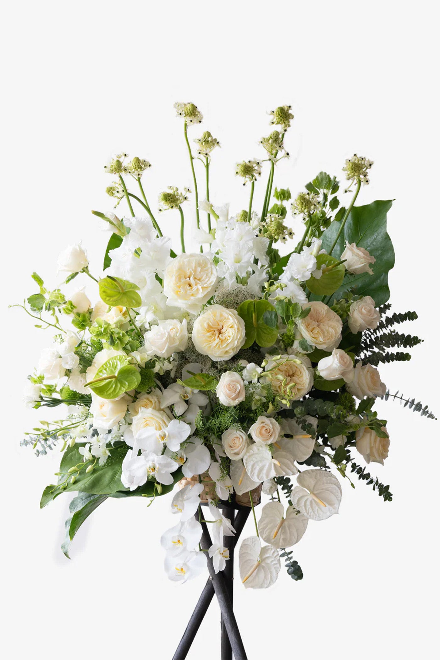 Me to You sympathy flower stand with Ecuadorian garden roses, white orchids, anthuriums, astrantias, and lush greenery