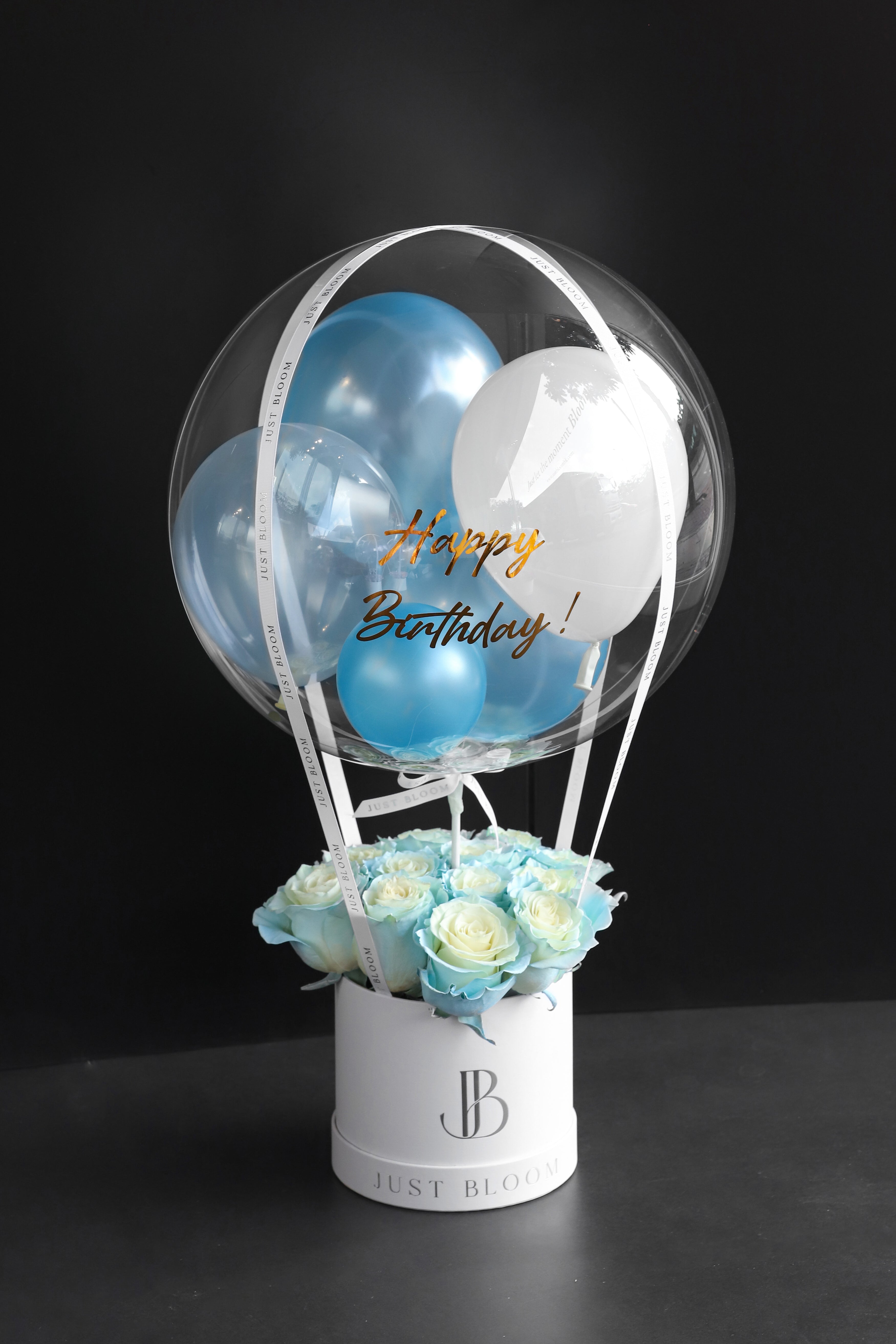 All-tinted blue rose flower box in a white Just Bloom round box against a dark background — Just Bloom Hong Kong