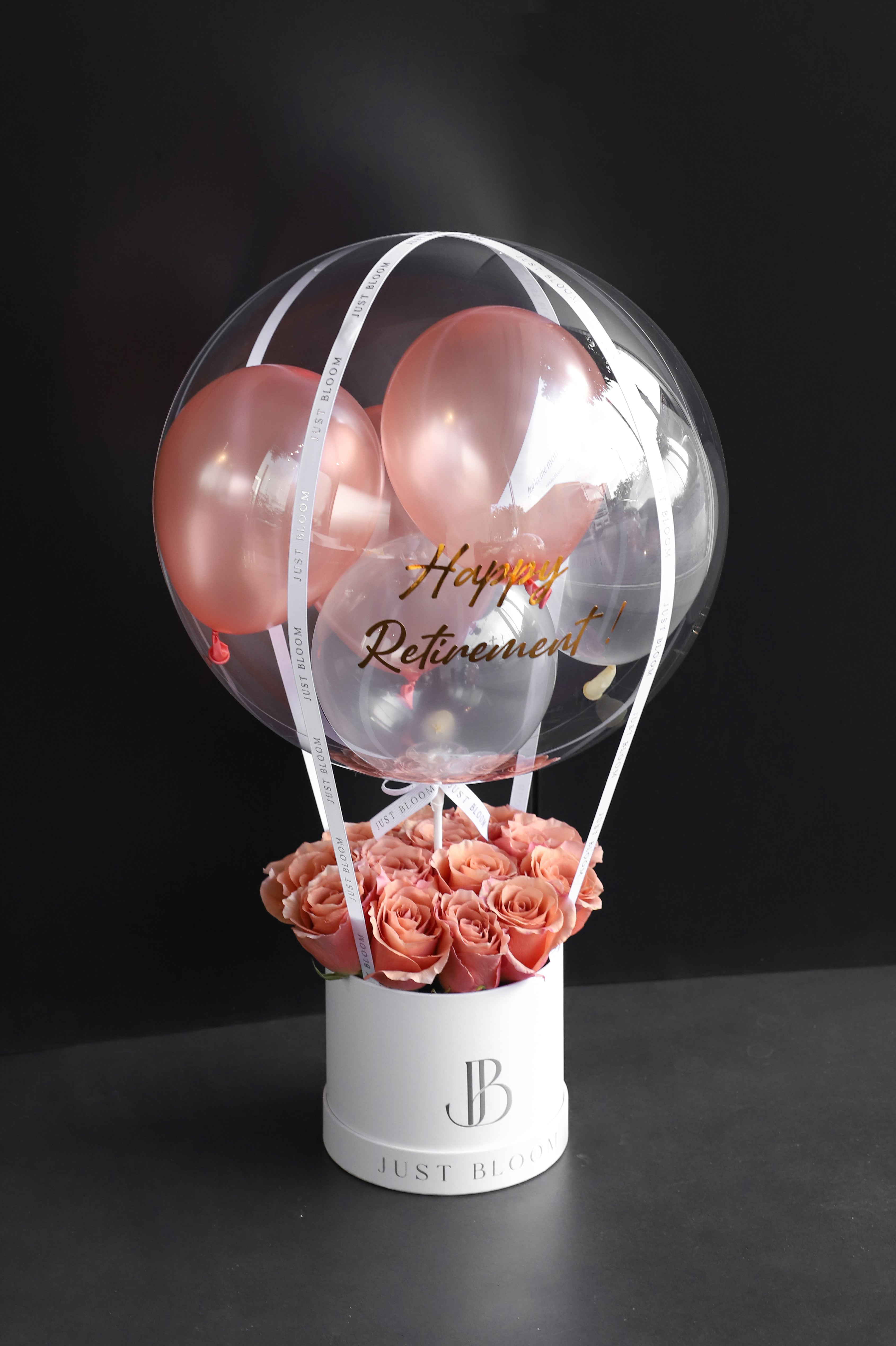 All-blush and salmon rose balloon flower box with a large crystal balloon containing rose-toned balloons in a white Just Bloom round box against a dark background — Just Bloom Hong Kong