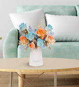 Fresh vase arrangements by Just bloom × Hong Kong Florist, featuring Ecuadorian dyed blue and orange roses symbolizing significant meanings, showcased in a sleek white vase, with vibrant hues.