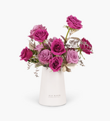 Floral arrangement of Fuchsia and Purple roses with green foliage showcased in a white vase by Just bloom × Hong Kong Florist, blending modern and classic elements for an elegant and romantic ambiance.