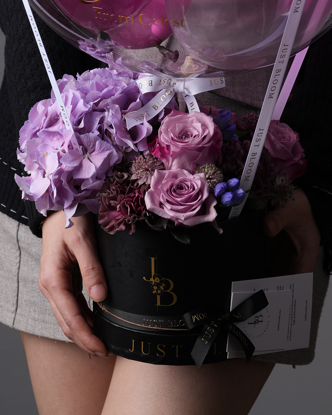 Close-up of Eliza showing mauve roses, hydrangeas, and textural fillers
