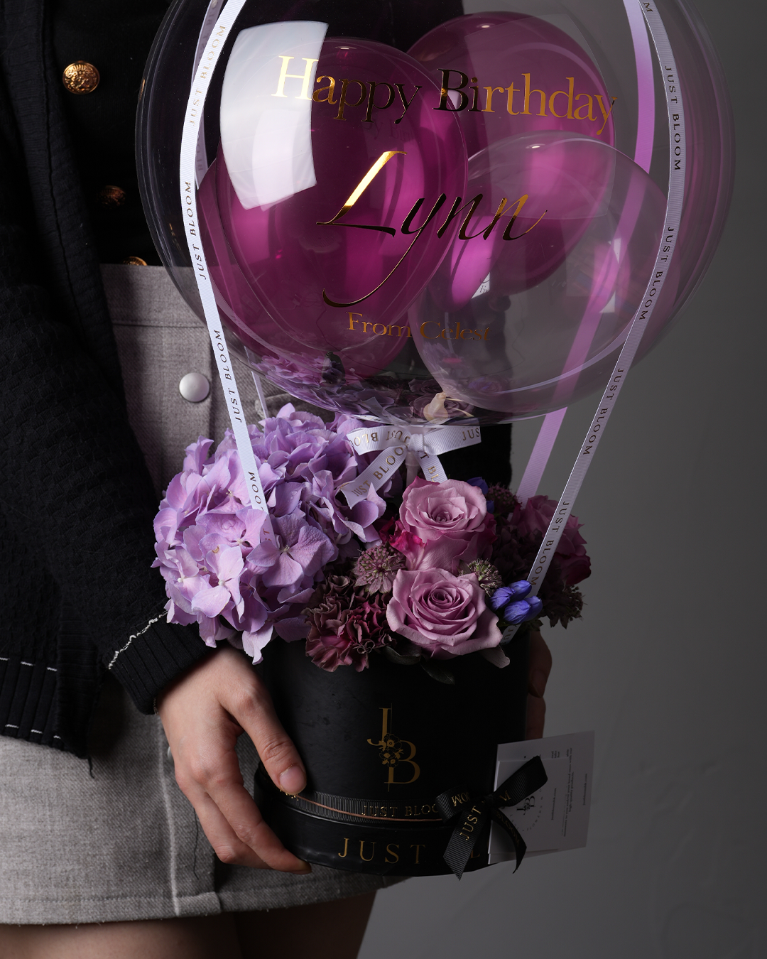 Eliza flower box with purple hydrangeas and dusty pink roses in black round box