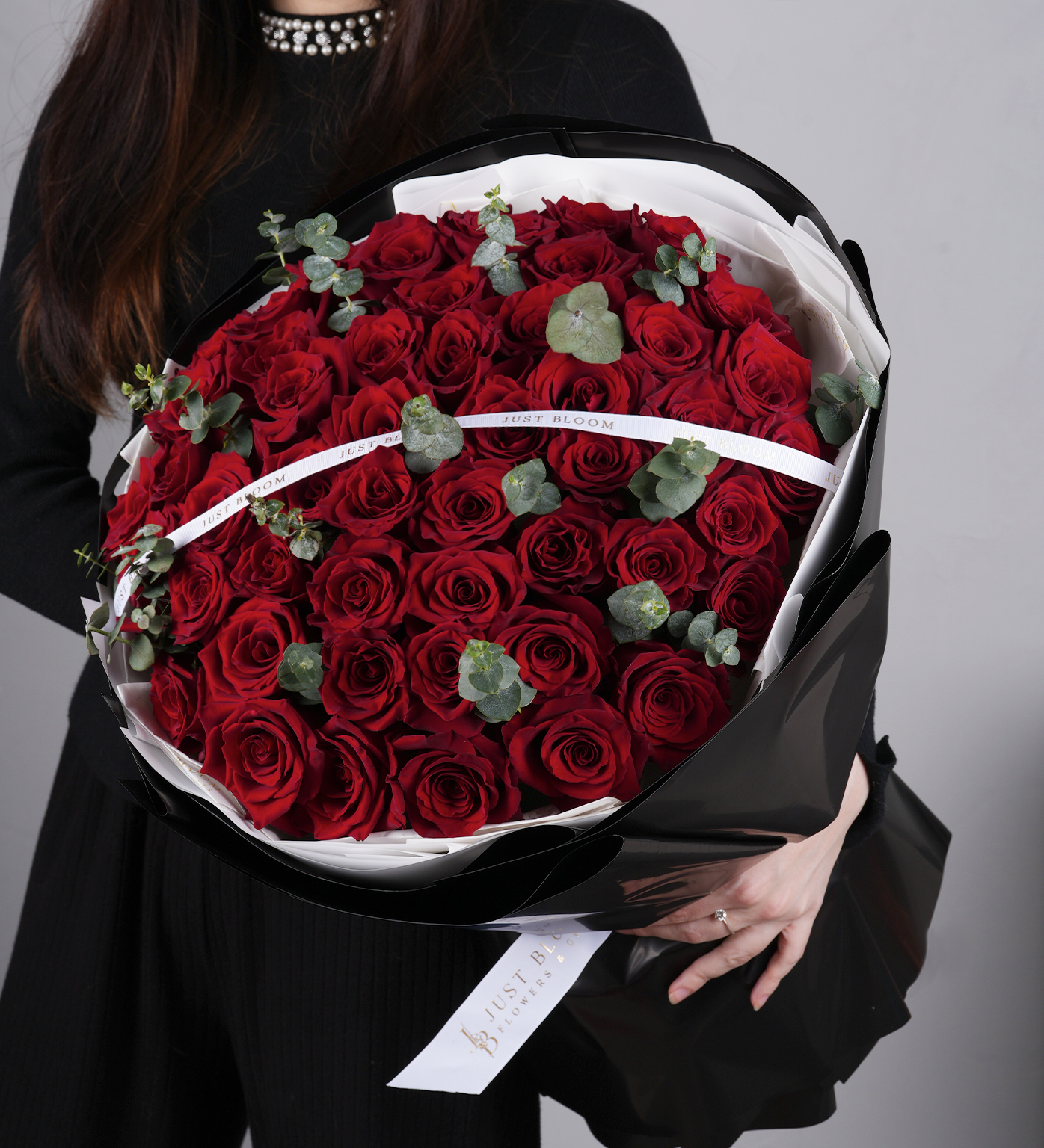 Close-up of Giselle bouquet by Just Bloom HK featuring lush red roses and eucalyptus