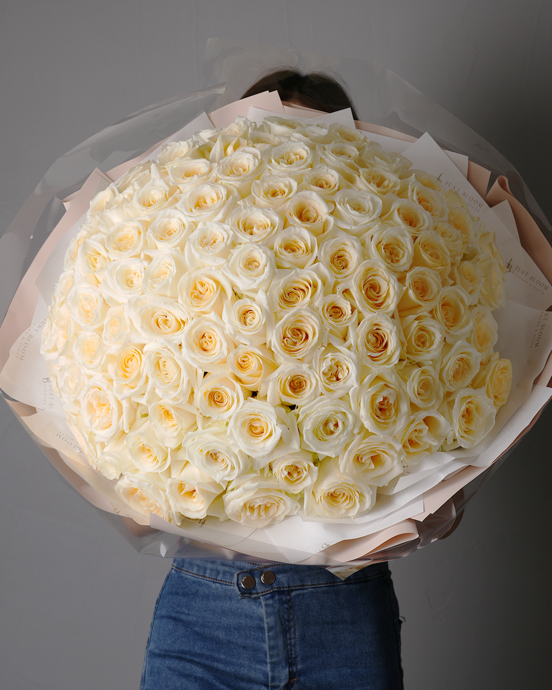 Margaret oversized bouquet with creamy yellow and ivory roses in full round arrangement