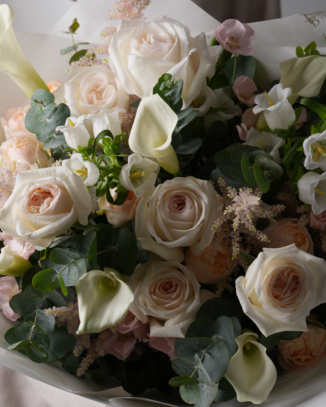 Melody bouquet featuring garden roses, calla lilies, and canterbury bells