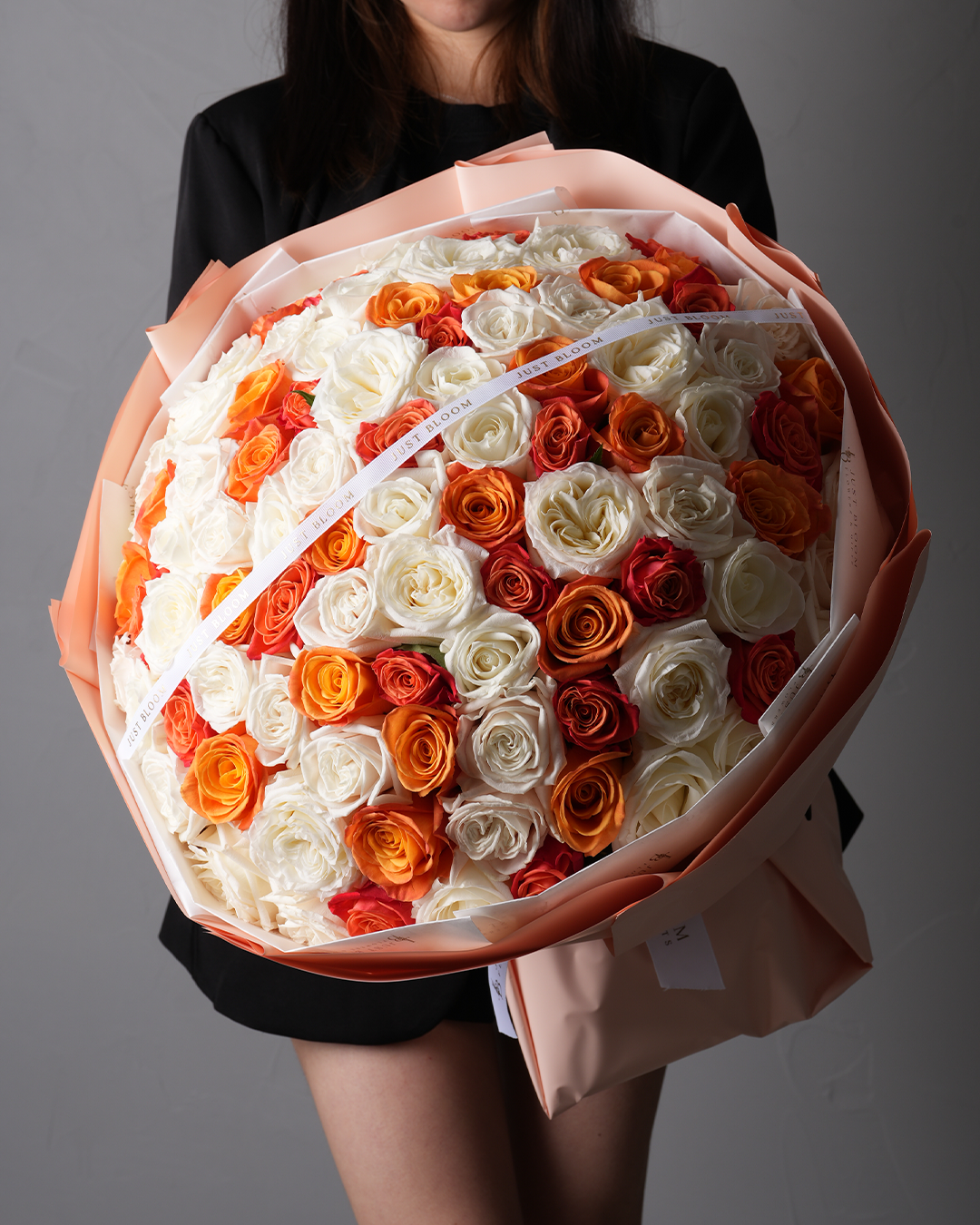 Rylee bouquet with premium Ecuadorian roses in orange, coral, and white tones