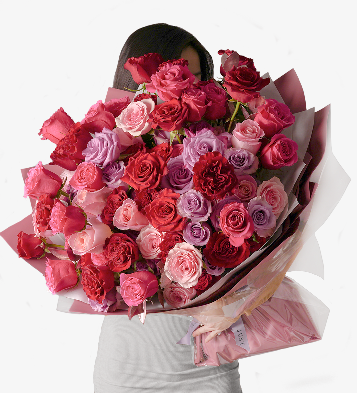 Sawyer bouquet with premium Ecuadorian red roses and pink roses, held in front of the body
